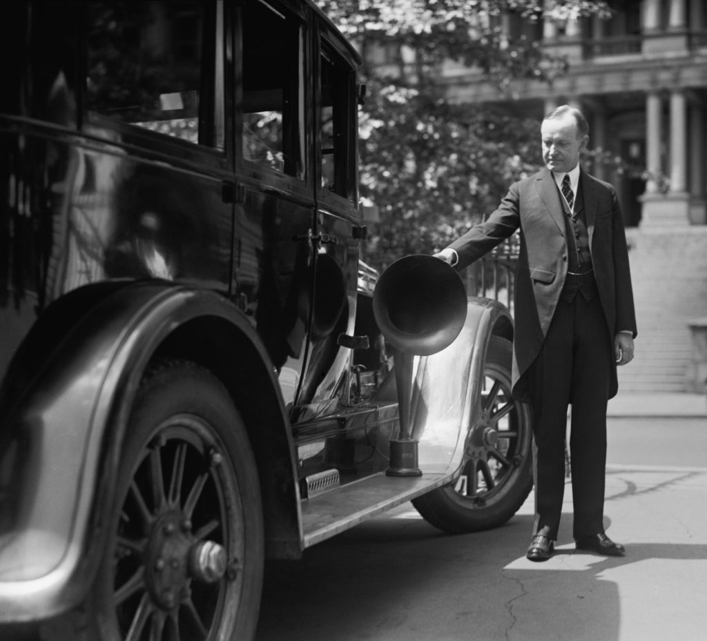 President Coolidge looking at a 1924 car.